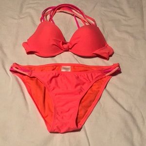 Bathing suit, coral orange color with pink